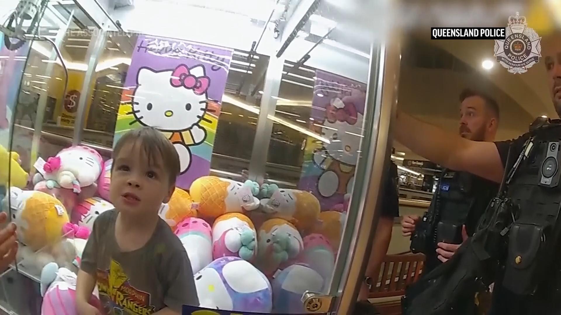 Toddler gets stuck in claw machine looking for a toy in Australian shopping mall